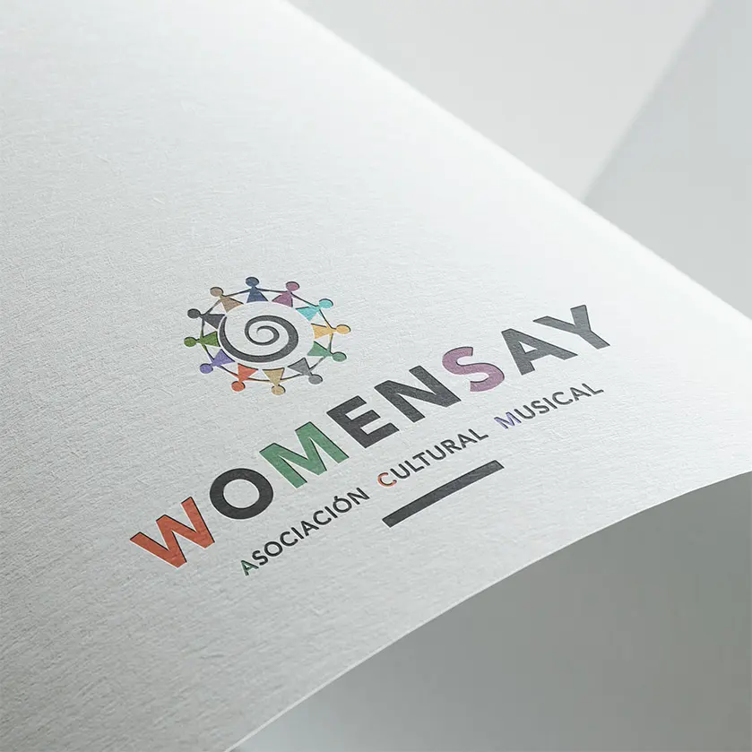 Womensey logó, sokszínű, az emberek kapcsolódását mutatja, ahogy a figurák kört alkotnak. Középen pedig jellegzetes tenerifei őslakos spirál-szimbólum van.